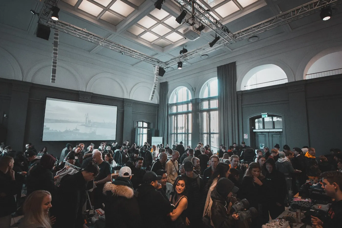 A lively gathering in a sunlit event venue